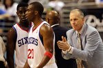 PHILADELPHIA, PA - APRIL 24: Coach Doug Collins of the Philadelphia 76ers gestures to players Jrue Holiday #11 (L) and Jodie Meeks #20 during the second half in Game Four of the Eastern Conference Quarterfinals in the 2011 NBA Playoffs at Wells Fargo Center on April 24, 2011 in Philadelphia, Pennsylvania. NOTE TO USER: User expressly acknowledges and agrees that, by downloading and/or using this Photograph, User is consenting to the terms and conditions of the Getty Images License Agreement.  (Photo by Rob Carr/Getty Images)