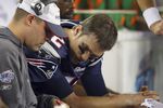 GLENDALE, AZ - FEBRUARY 03:  Quarterback Tom Brady #12 of of the New England Patriots sits on the bench with Offensive Coordinator Josh McDaniels during the fourth quarter of Super Bowl XLII against the New York Giants on February 3, 2008 at the University of Phoenix Stadium in Glendale, Arizona.  (Photo by Donald Miralle/Getty Images)