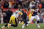 DENVER, CO - JANUARY 08:  Quarterback Tim Tebow #15 of the Denver Broncos eludes a tackle from  Lawrence Timmons #94 of the Pittsburgh Steelers during the AFC Wild Card Playoff game at Sports Authority Field at Mile High on January 8, 2012 in Denver, Colorado. The Broncos defeated the Steelers in overtime 23-29.  (Photo by Jeff Gross/Getty Images)