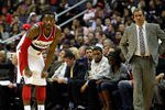 WASHINGTON, DC - JANUARY 06: Head coach Flip Saunders of the Washington Wizards (R) looks on as John Wall #2 gets set against the New York Knicks  at Verizon Center on January 6, 2012 in Washington, DC.  NOTE TO USER: User expressly acknowledges and agrees that, by downloading and or using this photograph, User is consenting to the terms and conditions of the Getty Images License Agreement.  (Photo by Rob Carr/Getty Images)