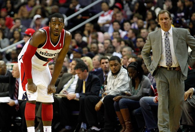 WASHINGTON, DC - JANUARY 06: Head coach Flip Saunders of the Washington Wizards (R) looks on as John Wall #2 gets set against the New York Knicks  at Verizon Center on January 6, 2012 in Washington, DC.  NOTE TO USER: User expressly acknowledges and agrees that, by downloading and or using this photograph, User is consenting to the terms and conditions of the Getty Images License Agreement.  (Photo by Rob Carr/Getty Images)
