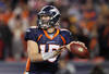 DENVER, CO - JANUARY 08:  Quarterback Tim Tebow #15 of the Denver Broncos looks to pass the ball to Demaryius Thomas #88 of the Denver Broncos to score an 80 yard touchdown in overtime of the AFC Wild Card Playoff game at Sports Authority Field against the Pittsburgh Steelers at Mile High on January 8, 2012 in Denver, Colorado. The Broncos defeated the Steelers in overtime 23-29.  (Photo by Jeff Gross/Getty Images)