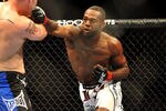 LAS VEGAS - JULY 11:  (R-L) Jon Jones connects with a right punch on Jake O'Brein during their light heavyweight bout during UFC 100 on July 11, 2009 in Las Vegas, Nevada. Jones defeated O'Brein by second round tapout.  (Photo by Jon Kopaloff/Getty Images)