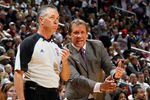 ATLANTA, GA - DECEMBER 28:  Flip Saunders of the Washington Wizards questions a call with referee Jason Phillips (l) at Philips Arena on December 28, 2011 in Atlanta, Georgia.  NOTE TO USER: User expressly acknowledges and agrees that, by downloading and or using this photograph, User is consenting to the terms and conditions of the Getty Images License Agreement.  (Photo by Kevin C. Cox/Getty Images)