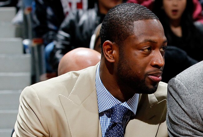 ATLANTA, GA - JANUARY 05:  LeBron James #6 and Dwyane Wade #3 of the Miami Heat watch from the bench against the Atlanta Hawks at Philips Arena on January 5, 2012 in Atlanta, Georgia.  NOTE TO USER: User expressly acknowledges and agrees that, by downloading and or using this photograph, User is consenting to the terms and conditions of the Getty Images License Agreement.  (Photo by Kevin C. Cox/Getty Images)