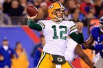 EAST RUTHERFORD, NJ - DECEMBER 04:  Aaron Rodgers #12 of the Green Bay Packers throws a pass against the New York Giants at MetLife Stadium on December 4, 2011 in East Rutherford, New Jersey. The Packers won 38-35.  (Photo by Chris Trotman/Getty Images)