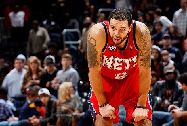 ATLANTA, GA - DECEMBER 30:  Deron Williams #8 of the New Jersey Nets reacts in the final seconds of their 105-98 loss to the Atlanta Hawks at Philips Arena on December 30, 2011 in Atlanta, Georgia.  NOTE TO USER: User expressly acknowledges and agrees that, by downloading and or using this photograph, User is consenting to the terms and conditions of the Getty Images License Agreement.  (Photo by Kevin C. Cox/Getty Images)