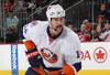 NEWARK, NJ - SEPTEMBER 30:  Trevor Gillies #14 of the New York Islanders skates against the New Jersey Devils at the Prudential Center on September 30, 2011 in Newark, New Jersey. The Devils defeated the Islanders 1-0.  (Photo by Bruce Bennett/Getty Images)
