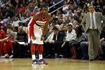 WASHINGTON, DC - JANUARY 06: Head coach Flip Saunders of the Washington Wizards (R) looks on as John Wall #2 gets set against the New York Knicks  at Verizon Center on January 6, 2012 in Washington, DC.  NOTE TO USER: User expressly acknowledges and agrees that, by downloading and or using this photograph, User is consenting to the terms and conditions of the Getty Images License Agreement.  (Photo by Rob Carr/Getty Images)