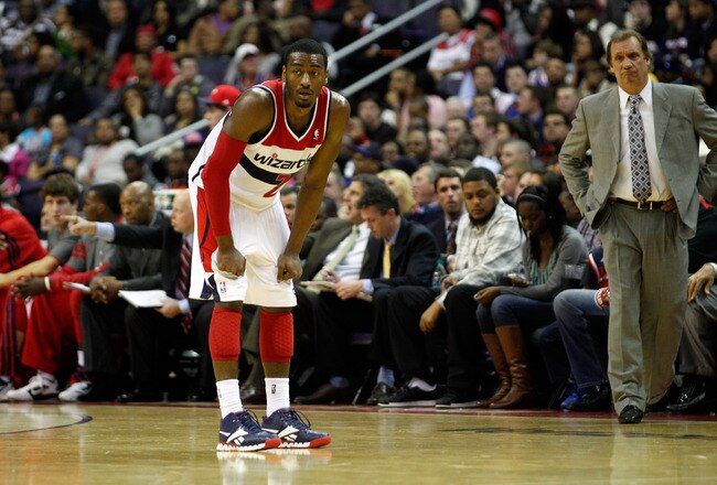 WASHINGTON, DC - JANUARY 06: Head coach Flip Saunders of the Washington Wizards (R) looks on as John Wall #2 gets set against the New York Knicks  at Verizon Center on January 6, 2012 in Washington, DC.  NOTE TO USER: User expressly acknowledges and agrees that, by downloading and or using this photograph, User is consenting to the terms and conditions of the Getty Images License Agreement.  (Photo by Rob Carr/Getty Images)