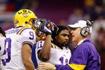 NEW ORLEANS, LA - JANUARY 09:  Head coach Les Miles of the Louisiana State University Tigers talks with Jordan Jefferson #9 on from the sidelines against the Alabama Crimson Tide during the 2012 Allstate BCS National Championship Game at Mercedes-Benz Superdome on January 9, 2012 in New Orleans, Louisiana.  (Photo by Chris Graythen/Getty Images)
