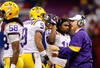 NEW ORLEANS, LA - JANUARY 09:  Head coach Les Miles of the Louisiana State University Tigers talks with Jordan Jefferson #9 on from the sidelines against the Alabama Crimson Tide during the 2012 Allstate BCS National Championship Game at Mercedes-Benz Superdome on January 9, 2012 in New Orleans, Louisiana.  (Photo by Chris Graythen/Getty Images)