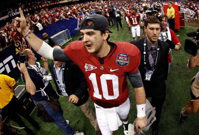 NEW ORLEANS, LA - JANUARY 09:   AJ McCarron #10 of the Alabama Crimson Tide celebrates after defeating Louisiana State University Tigers in the 2012 Allstate BCS National Championship Game at Mercedes-Benz Superdome on January 9, 2012 in New Orleans, Louisiana. Alabama  won the game by a score of 22-0.  (Photo by Chris Graythen/Getty Images)