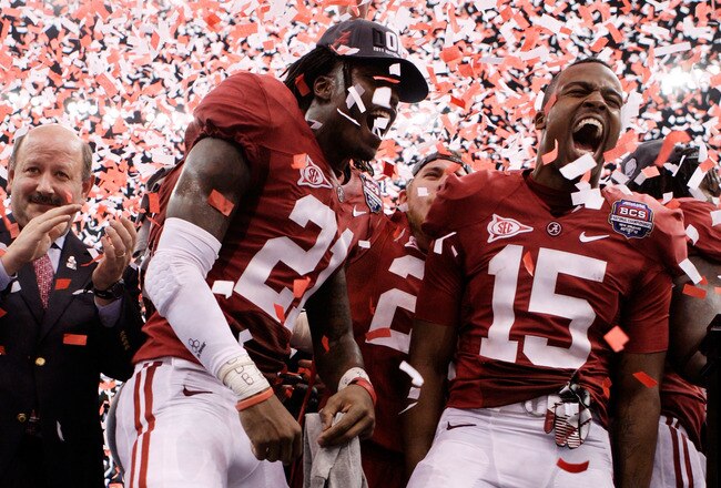 NEW ORLEANS, LA - JANUARY 09:  Dre Kirkpatrick #21 and Darius Hanks #15 of the Alabama Crimson Tide celebrate after defeating Louisiana State University Tigers in the 2012 Allstate BCS National Championship Game at Mercedes-Benz Superdome on January 9, 2012 in New Orleans, Louisiana. Alabama  won the game by a score of 21-0.  (Photo by Andy Lyons/Getty Images)