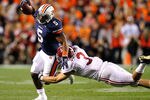 AUBURN, AL - NOVEMBER 26:  Michael Dyer #5 of the Auburn Tigers is tackled by Vinnie Sunseri #3 of the Alabama Crimson Tide at Jordan-Hare Stadium on November 26, 2011 in Auburn, Alabama.  (Photo by Kevin C. Cox/Getty Images)