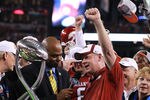 ARLINGTON, TX - JANUARY 06:  Head coach Bobby Petrino of the Arkansas Razorbacks celebrates the Cotton Bowl trophy after defeating the Kansas State Wildcats at Cowboys Stadium on January 6, 2012 in Arlington, Texas.  (Photo by Ronald Martinez/Getty Images)