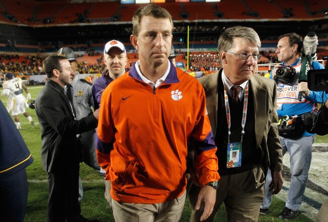 MIAMI GARDENS, FL - JANUARY 04:  Head coach Dabo Swinney of the Clemson Tigers walks off of the field dejected after they lost to the West Virginia Mountaineers 70-33 during the Discover Orange Bowl at Sun Life Stadium on January 4, 2012 in Miami Gardens, Florida.  (Photo by Streeter Lecka/Getty Images)
