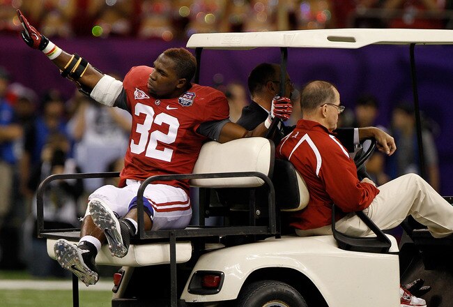 NEW ORLEANS, LA - JANUARY 09:  C.J. Mosley #32 of the Alabama Crimson Tide waves as he is carted off of the field after he was injured while playing against the Louisiana State University Tigers during the 2012 Allstate BCS National Championship Game at Mercedes-Benz Superdome on January 9, 2012 in New Orleans, Louisiana.  (Photo by Chris Graythen/Getty Images)