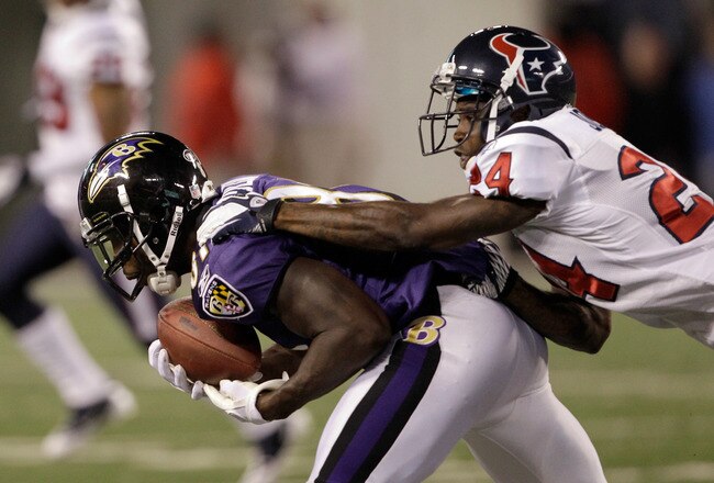 BALTIMORE, MD - OCTOBER 16: Wide receiver  Anquan Boldin #81 of the Baltimore Ravens makes a catch in front of defender Johnathan Joseph #24 of the Houston Texans at M&T Bank Stadium on October 16, 2011 in Baltimore, Maryland. The Ravens won 29-14.  (Photo by Rob Carr/Getty Images)