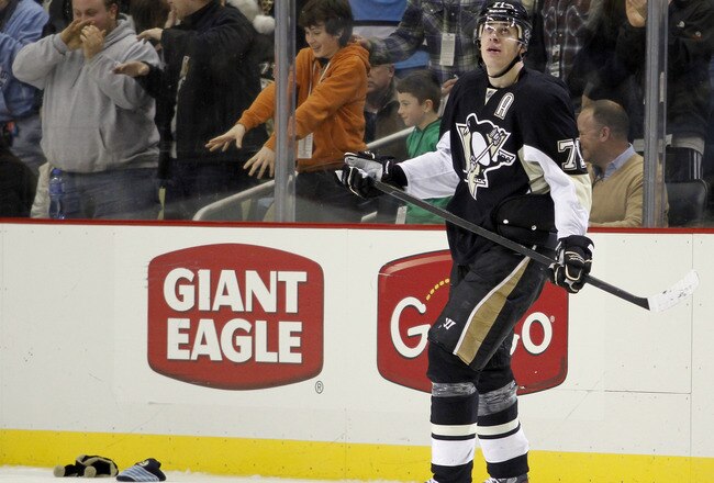PITTSBURGH, PA - DECEMBER 17:  Evgeni Malkin #71 of the Pittsburgh Penguins looks at the replay after scoring a hat trick in the third period on the power play against the Buffalo Sabres during the game at Consol Energy Center on December 17, 2011 in Pittsburgh, Pennsylvania.  The Penguins won 8-3.  (Photo by Justin K. Aller/Getty Images)