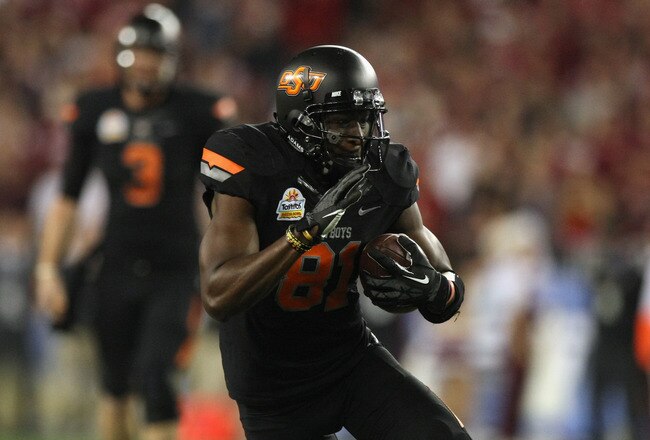 GLENDALE, AZ - JANUARY 02:  Justin Blackmon #81 of the Oklahoma State Cowboys catches a first down pass on a fourth down play against the Stanford Cardinal during the Tostitos Fiesta Bowl on January 2, 2012 at University of Phoenix Stadium in Glendale, Arizona.  (Photo by Donald Miralle/Getty Images)
