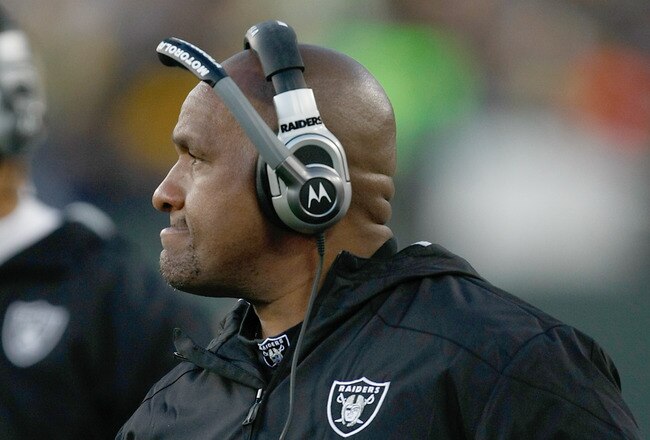 GREEN BAY, WI - DECEMBER 11: Head coach Hue Jackson of the Oakland Raiders looks on during the game against the Green Bay Packers at Lambeau Field on December 11, 2011 in Green Bay, Wisconsin. (Photo by Scott Boehm/Getty Images)