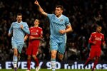 MANCHESTER, ENGLAND - JANUARY 03:  James Milner of Manchester City celebrates scoring his team's third goal, from a penalty kick, during the Barclays Premier League match between Manchester City and Liverpool at the Etihad Stadium on January 3, 2012 in Manchester, England. (Photo by Clive Mason/Getty Images)