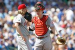 CHICAGO, IL - AUGUST 07: Bronson Arroyo #61 of the Cincinnati Reds talks with Ryan Hanigan #29 against the Chicago Cubs at Wrigley Field on August 7, 2011 in Chicago, Illinois. (Photo by Scott Boehm/Getty Images)