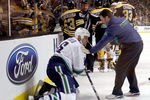 BOSTON, MA - JANUARY 07:  Sami Salo #6 of the Vancouver Canucks is helped off the ice after he was hit by Brad Marchand #63 of the Boston Bruins on January 7, 2012 at TD Garden in Boston, Massachusetts.  (Photo by Elsa/Getty Images)