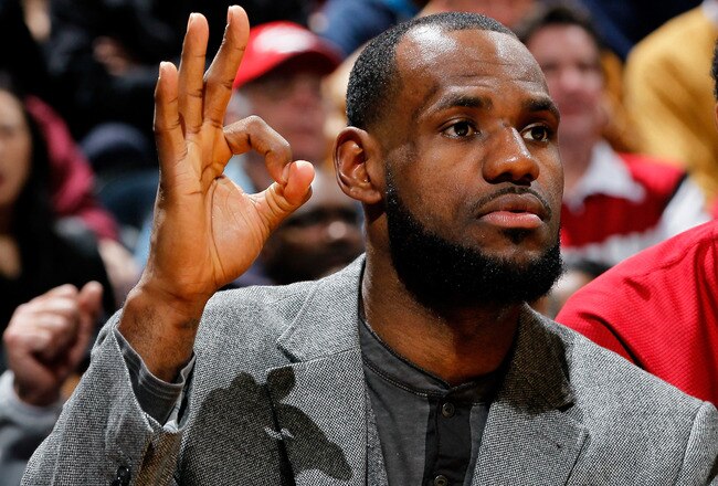 ATLANTA, GA - JANUARY 05:  LeBron James #6 of the Miami Heat reacts from the bench after a teammate's three-point basket against the Atlanta Hawks at Philips Arena on January 5, 2012 in Atlanta, Georgia.  NOTE TO USER: User expressly acknowledges and agrees that, by downloading and or using this photograph, User is consenting to the terms and conditions of the Getty Images License Agreement.  (Photo by Kevin C. Cox/Getty Images)