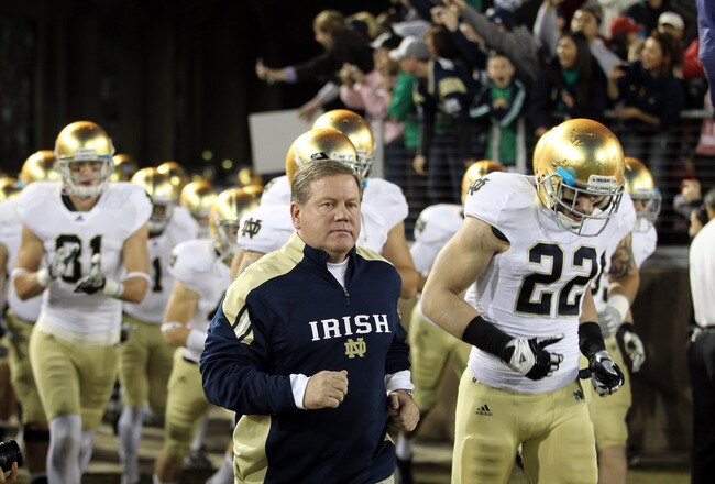 STANFORD, CA - NOVEMBER 26:  Notre Dame Fighting Irish head coach Brian Kelly run on to the field for their game against the Stanford Cardinal at Stanford Stadium on November 26, 2011 in Stanford, California.  (Photo by Ezra Shaw/Getty Images)