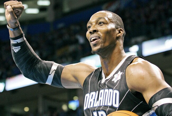 OKLAHOMA CITY, OK - DECEMBER 25:  Dwight Howard #12 of the Orlando Magic looks to have a foul called during the NBA season opening game against the Oklahoma City Thunder December 25, 2011 at the Chesapeake Energy Arena in Oklahoma City, Oklahoma.  Oklahoma City defeated Orlando 97-89. NOTE TO USER: User expressly acknowledges and agrees that, by downloading and or using this Photograph, user is consenting to the terms and conditions of the Getty Images License Agreement.  (Photo by Brett Deering/Getty Images)