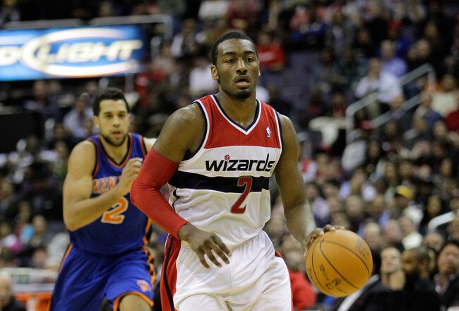 WASHINGTON, DC - JANUARY 06:  John Wall #2 of the Washington Wizards brings the ball up the floor against the New York Knicks at Verizon Center on January 6, 2012 in Washington, DC.  NOTE TO USER: User expressly acknowledges and agrees that, by downloading and or using this photograph, User is consenting to the terms and conditions of the Getty Images License Agreement.  (Photo by Rob Carr/Getty Images)