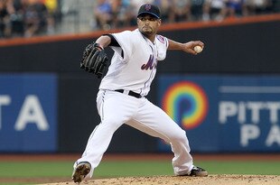 NEW YORK - JULY 06:  Johan Santana #57 of the New York Mets delivers a pitch against the Cincinnati Reds on July 6, 2010 at Citi Field in the Flushing neighborhood of the Queens borough of New York City.  (Photo by Jim McIsaac/Getty Images)