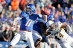BOISE, ID - NOVEMBER 26:  Kellen Moore #11 of the Boise State Broncos passes against the Wyoming Cowboys at Bronco Stadium on November 26, 2011 in Boise, Idaho.  (Photo by Otto Kitsinger III/Getty Images)