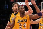 LOS ANGELES, CA - JANUARY 10: Kobe Bryant #24 and Pau Gasol #16 of the Los Angeles Lakers celebrate a Bryant basket against the Phoenix Suns at Staples Center on January 10, 2012 in Los Angeles, California. The Lakers won 99-83. NOTE TO USER: User expressly acknowledges and agrees that, by downloading and or using this photograph, User is consenting to the terms and conditions of the Getty Images License Agreement.  (Photo by Stephen Dunn/Getty Images)