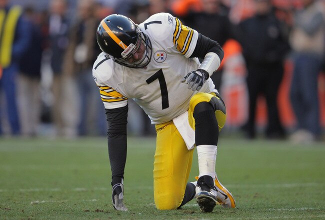 DENVER, CO - JANUARY 08:  Quarterback Ben Roethlisberger #7 of the Pittsburgh Steelers gets up slowly after throwing an interception to Quinton Carter #28 of the Denver Broncos in the second quarter at Sports Authority Field at Mile High on January 8, 2012 in Denver, Colorado. The Broncos defeated the Steelers 29-23 in overtime of their AFC Wild Card Playoff game.  (Photo by Doug Pensinger/Getty Images)