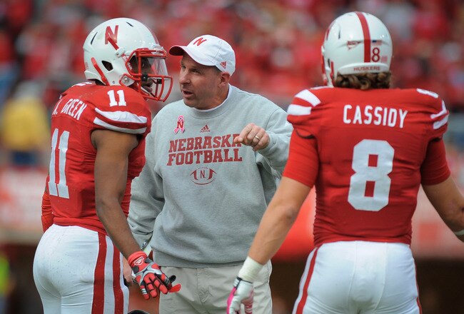 LINCOLN, NE - OCTOBER 29: Nebraska Cornhuskers coach Bo Pelini talk to cornerback Andrew Green #11 and safety Austin Cassidy #8 of the Nebraska Cornhuskers during their game against the Michigan State Spartans at Memorial Stadium October 29, 2011 in Lincoln, Nebraska. Nebraska defeated Michigan State 24-3. (Photo by Eric Francis/Getty Images)
