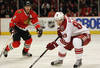 CHICAGO, IL - DECEMBER 05: Mikkel Boedker #89 of the Phoenix Coyotes turns with the puck in front of Duncan Keith #2 of the Chicago Blackhawks at the United Center on December 5, 2011 in Chicago, Illinois. The Coyotes defeated the Blackhawks 4-3 in a shootout.  (Photo by Jonathan Daniel/Getty Images)