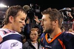 DENVER, CO - DECEMBER 18:  Quarterback Tom Brady #12 of the New England Patriots talks with quarterback Tim Tebow #15 of the Denver Broncos after the game at Sports Authority Field at Mile High on December 18, 2011 in Denver, Colorado. The Patriots defeated the Broncos 41-23.  (Photo by Doug Pensinger/Getty Images)