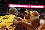 CHICAGO, IL - APRIL 26: Taj Gibson #22 of the Chicago Bulls gets hit in the face by Dahntay Jones #1 of the Indiana Pacers as he battles for the ball with (L-R) Jones, Danny Granger #33 and Josh McRoberts #32 in Game Five of the Eastern Conference Quarterfinals in the 2011 NBA Playoffs at the United Center on April 26, 2011 in Chicago, Illinois. The Bulls defeated the Pacers 116-89. NOTE TO USER: User expressly acknowledges and agrees that, by downloading and/or using this photograph, User is consenting to the terms and conditions of the Getty Images License Agreement. (Photo by Jonathan Daniel/Getty Images)