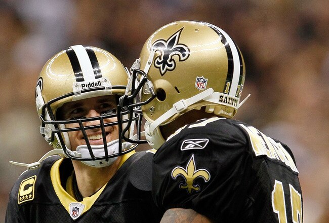 NEW ORLEANS, LA - JANUARY 07:  Drew Brees #9 and  Robert Meachem #17 of the New Orleans Saints celebrate after their touchdown in the fourth quarter against the Detroit Lions during their 2012 NFC Wild Card Playoff game at Mercedes-Benz Superdome on January 7, 2012 in New Orleans, Louisiana.  (Photo by Kevin C. Cox/Getty Images)