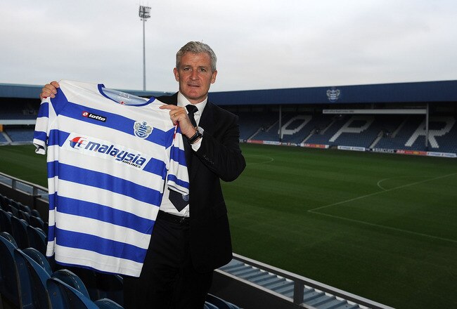 LONDON, ENGLAND - JANUARY 11:  New Queens Park Rangers manager Mark Hughes holds up a QPR shirt during the unveiling of the new Queens Park Rangers Manager at Loftus Road on January 11, 2012 in London, England.  (Photo by Christopher Lee/Getty Images)