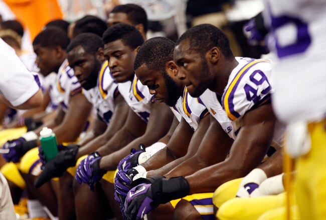 NEW ORLEANS, LA - JANUARY 09:  The Louisiana State University Tigers look on from the bench against the Alabama Crimson Tide during the 2012 Allstate BCS National Championship Game at Mercedes-Benz Superdome on January 9, 2012 in New Orleans, Louisiana.  (Photo by Chris Graythen/Getty Images)