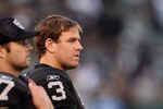 OAKLAND, CA - JANUARY 01:  Carson Palmer #3 of the Oakland Raiders stands on the sidelines during the closing minutes of their loss to the San Diego Chargers at O.co Coliseum on January 1, 2012 in Oakland, California.  (Photo by Ezra Shaw/Getty Images)