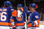 UNIONDALE, NY - JANUARY 10:  John Tavares #91 of the New York Islanders celebrates his goal with teammates Andrew MacDonald #47 and Matt Moulson #26 during their game on January10, 2012 at the Nassau Coliseum in Uniondale, New York.  (Photo by Al Bello/Getty Images)