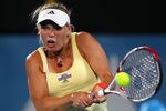SYDNEY, AUSTRALIA - JANUARY 11:  Caroline Wozniacki of Denmark plays a backhand in her quarter final match against Agnieszka Radwanska of Poland during day four of the 2012 Sydney International at Sydney Olympic Park Tennis Centre on January 11, 2012 in Sydney, Australia.  (Photo by Matt King/Getty Images)
