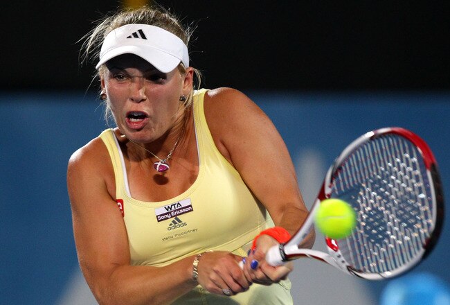 SYDNEY, AUSTRALIA - JANUARY 11:  Caroline Wozniacki of Denmark plays a backhand in her quarter final match against Agnieszka Radwanska of Poland during day four of the 2012 Sydney International at Sydney Olympic Park Tennis Centre on January 11, 2012 in Sydney, Australia.  (Photo by Matt King/Getty Images)