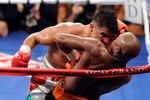 LAS VEGAS, NV - SEPTEMBER 17:  Victor Ortiz reaches his head out as Floyd Mayweather Jr. is against the rope in the fourth round during their WBC welterweight title fight at the MGM Grand Garden Arena on September 17, 2011 in Las Vegas, Nevada. Referee Joe Cortez called Ortiz for an illegal head-butt.  (Photo by Ethan Miller/Getty Images)