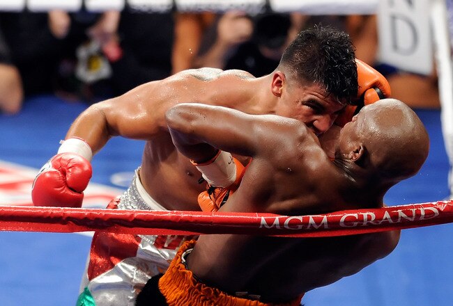 LAS VEGAS, NV - SEPTEMBER 17:  Victor Ortiz reaches his head out as Floyd Mayweather Jr. is against the rope in the fourth round during their WBC welterweight title fight at the MGM Grand Garden Arena on September 17, 2011 in Las Vegas, Nevada. Referee Joe Cortez called Ortiz for an illegal head-butt.  (Photo by Ethan Miller/Getty Images)